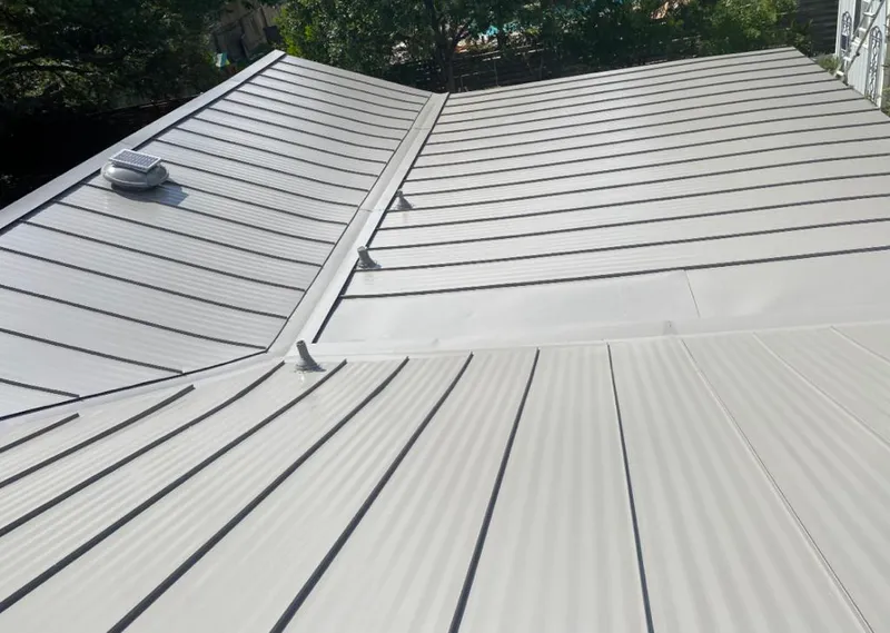 Solar attic fan installed on a metal roof for Roof Ventilation in Paradise Valley